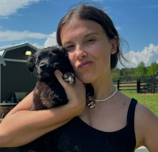 Millie pictured with a puppy on her farm in Georgia